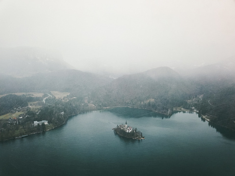 Drone photo of winter lake Bled, Julian Alps and beautiful island