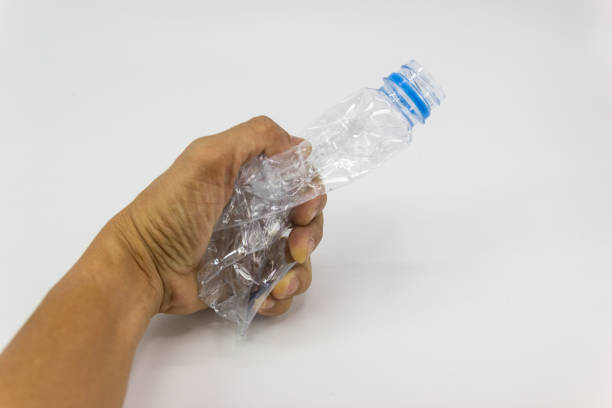 istock Hand man holding recyclable plastic bottle 1051767316