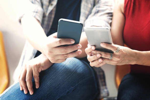 istock Group friends sitting and using smartphone for connection technology and start up project and business together. 1051769408