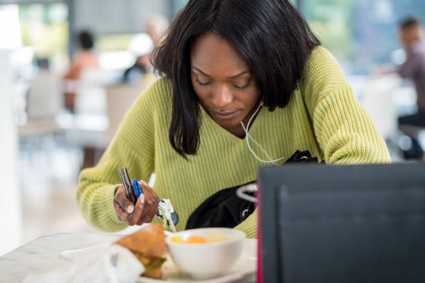 istock Young black woman at lunch 1051777876