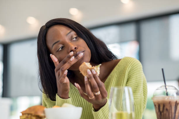 istock Young black woman at lunch 1051780544