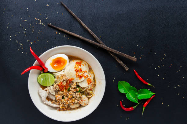istock Spicy lemongrass soup noodle  with Soft-boiled eggs top view 1051781702
