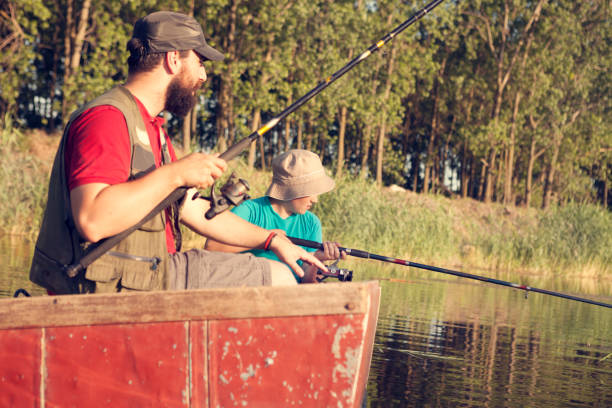 istock father and son fishing with rods 1051784926