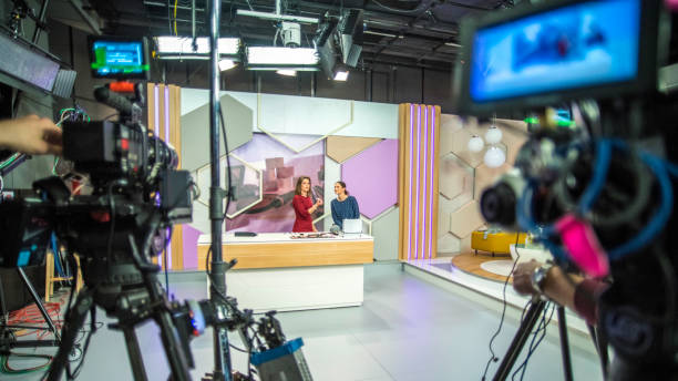 Behind the scenes of a TV show Photo of video recording equipment and stage in a studio during the filming of a TV show. broadcasting stock pictures, royalty-free photos & images