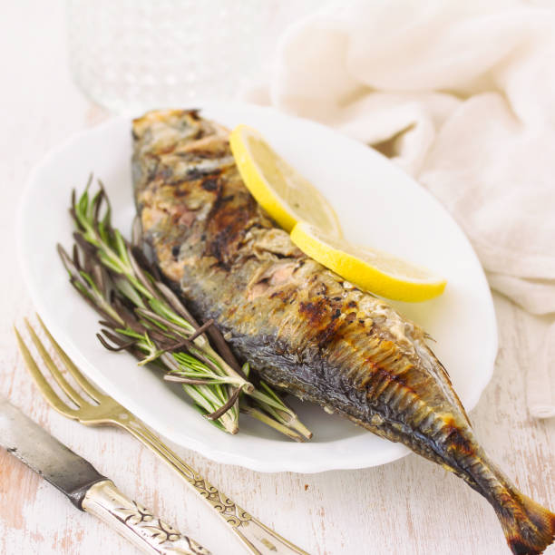 istock grilled fish with lemon on plate 1051789958