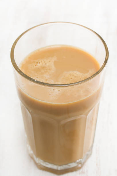 istock coffee with milk in glass 1051792282