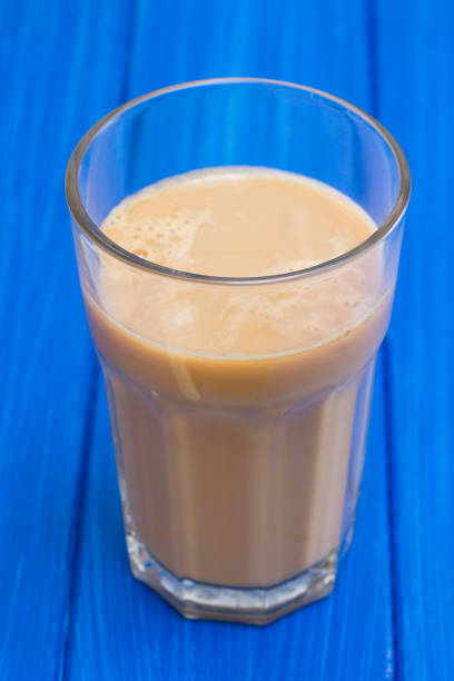 istock coffee with milk in glass 1051792290
