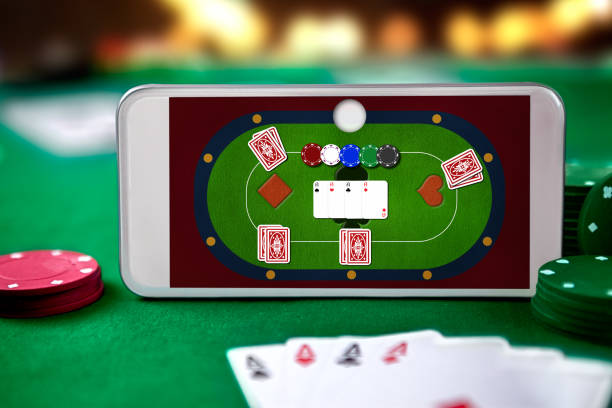 istock Smartphone with playing cards and chip cards 1051792334