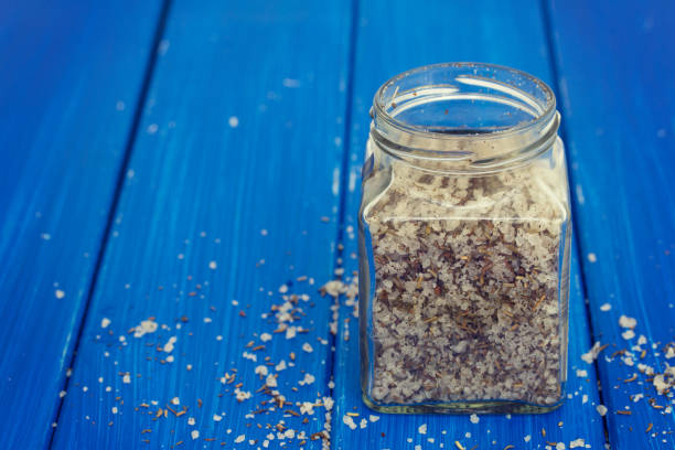 istock salt with herbs in jar on wooden background 1051792932