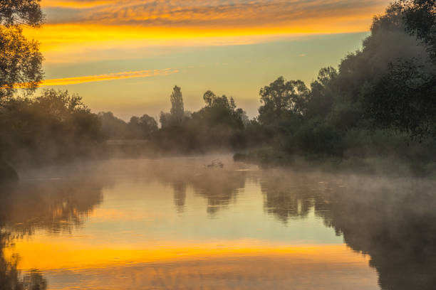 istock Beautiful misty morning on river 1051794642