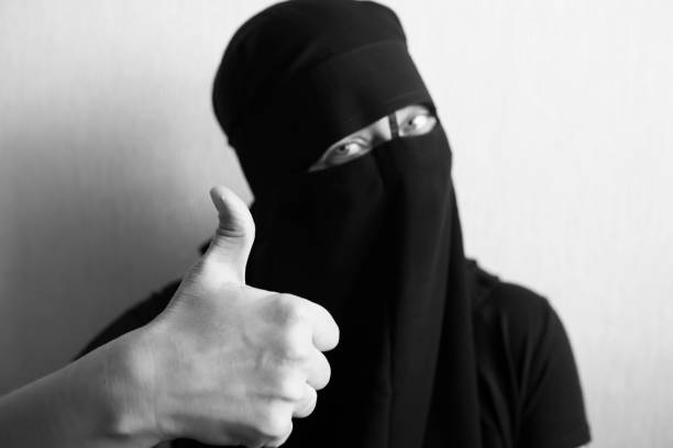 istock Woman in niqab shows thumb 1051797644