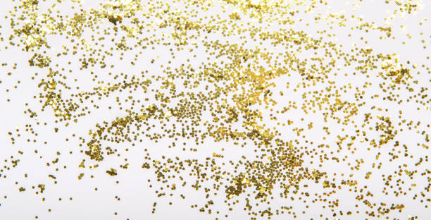 istock Festive Christmas shiny golden sparkles on a white background. Simple background, top view, fat ley 1051798708