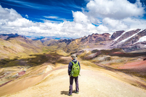 Standing on the top of Rainbow Mountain. stock photo