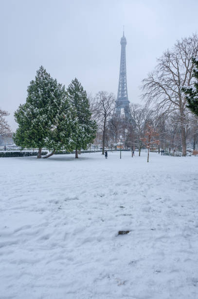 istock Eiffel tower under the snow in winter in Paris 1051802664