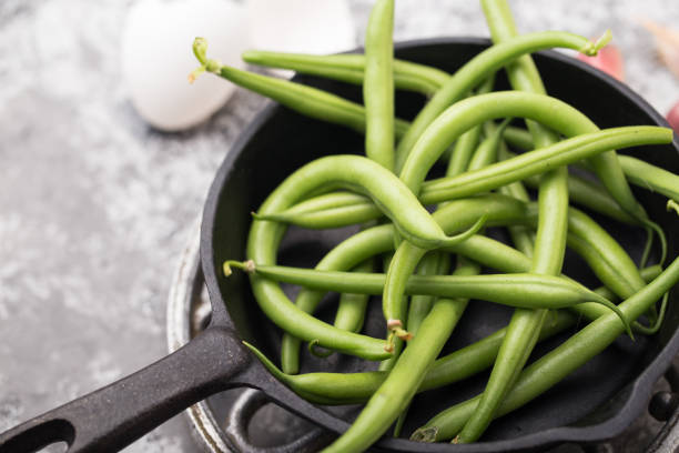 istock Runner beans with egg and garlic, cooking recipe 1051803896