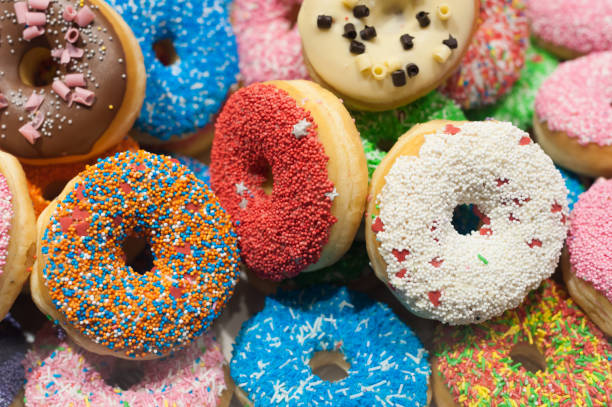 istock Bunch of multicolor donuts closeup 1051804350