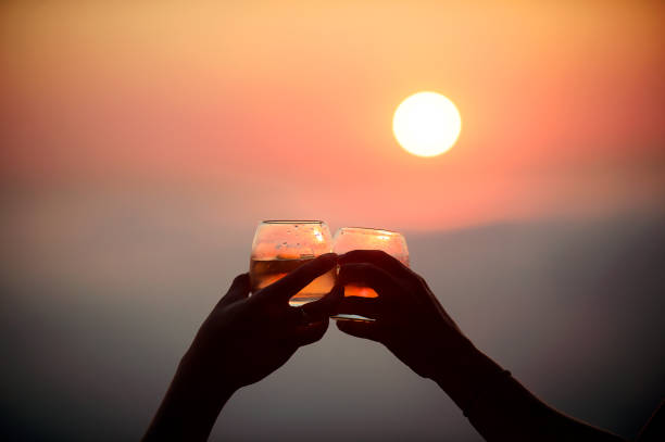 istock Silhouette Celebration Toast After Work Romantic Sundowners Above the clouds at sunset 1051804934