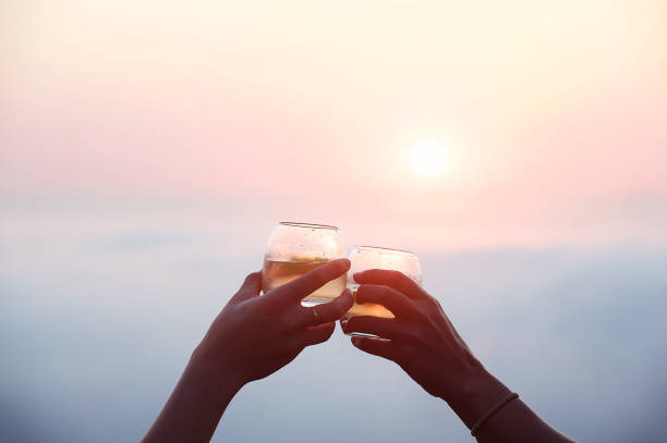 After Work Romantic Sundowners Above the clouds at a light sunset