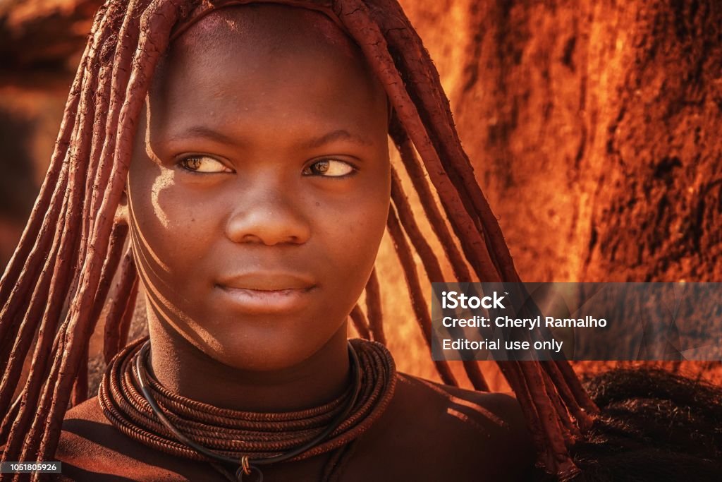 A Closeup Of A Young Himba Woman Wearing The Traditional Hairstyle Leather  Necklaces And Ochre Tinted Skin Paste Of Tribe In Namibia Stock Photo -  Download Image Now - iStock