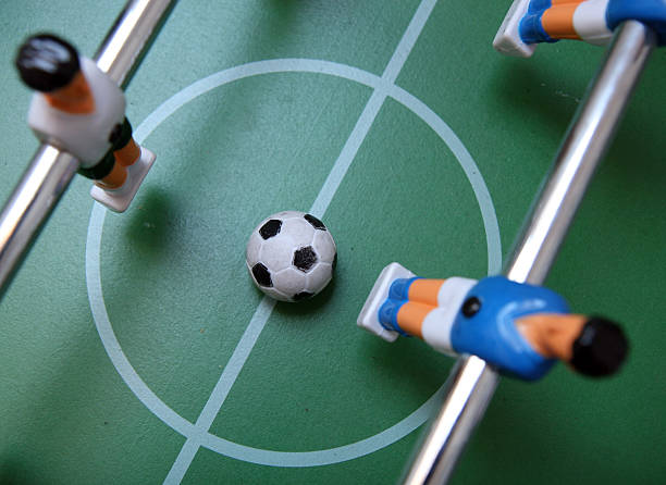 istock playing a table soccer /  foosball game 105181330