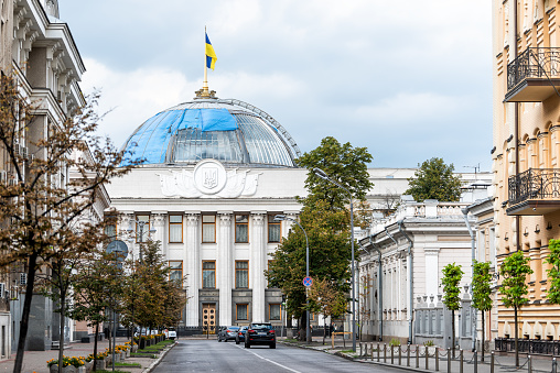 Kyiv, Ukraine - August 12, 2018: Ukrainian parliament building, Verhovna Rada with flag, streetscape of Kiev, nobody