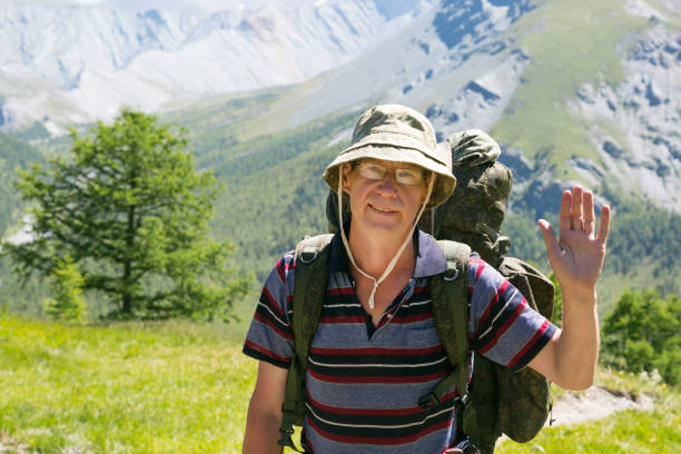 istock A tourist waving his hand in greeting. 1051816858