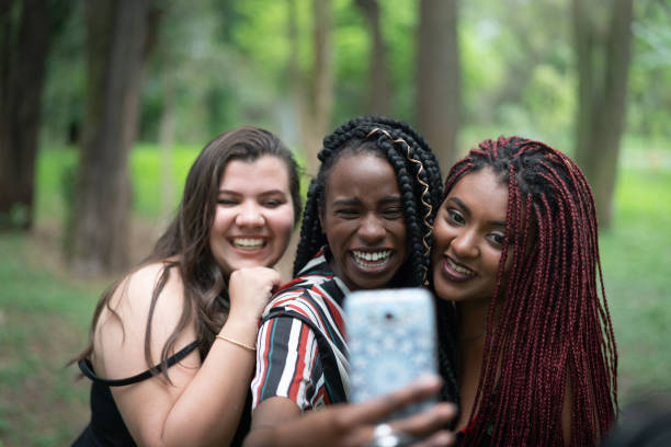 istock Best girlfriends taking a selfie at park 1051820442