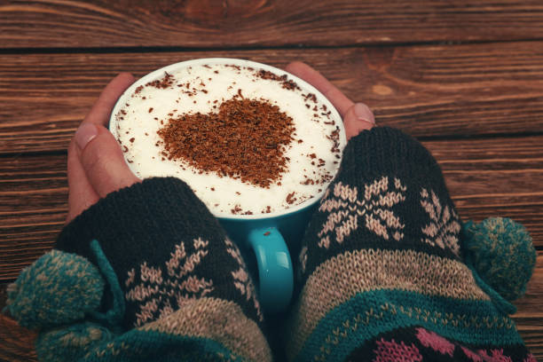 istock Woman hands hold full latte cappuccino coffee cup 1051820932