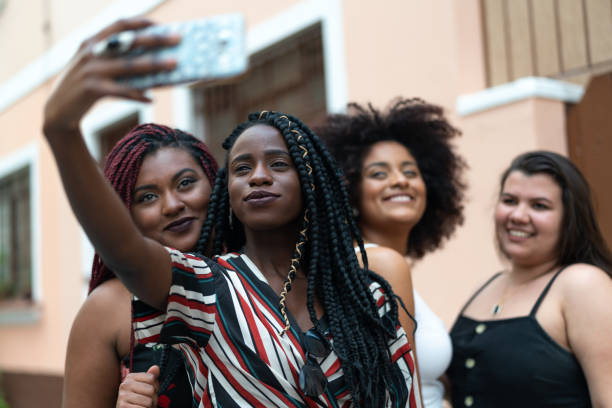 istock Best girlfriends taking a selfie with mobile phone 1051821088
