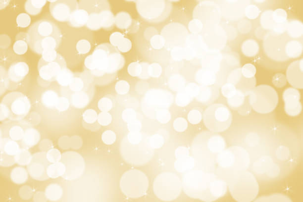 istock Abstract illustration bokeh light on golden background 1051821102