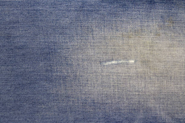 istock Texture of blue jeans textile background 1051821462