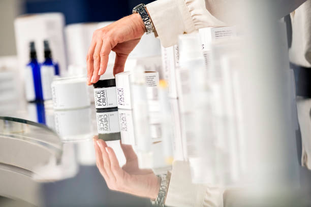 istock Close-up of a hand holding a container with face cream 1051825718