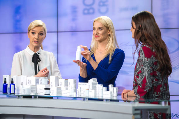 Three women talking about cosmetics on a TV infomercial