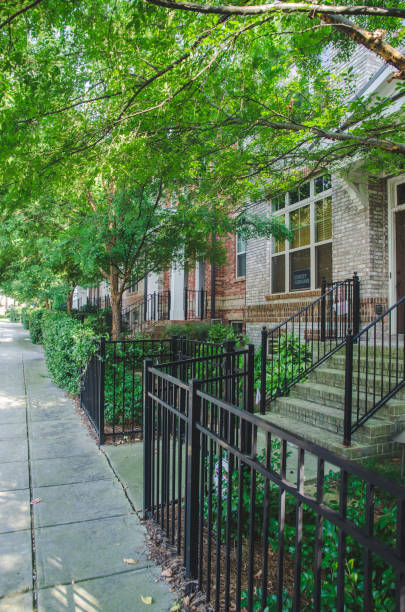 istock side view of house with tree and sidewalk 1051828528