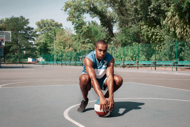 istock Picture of young confused african basketball player practicing 1051833886