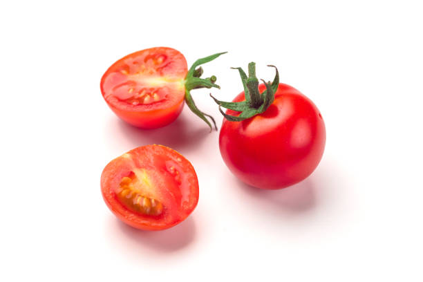 istock Close-up view of fresh tomato isolated on white background. 1051845868