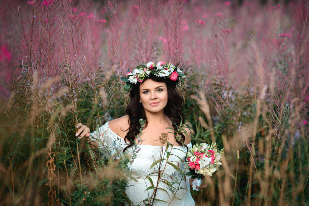 istock Brunette girl with a floral wreath 1051857042