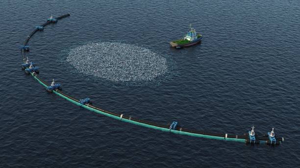 sistema di pulizia degli oceani - oil slick foto e immagini stock
