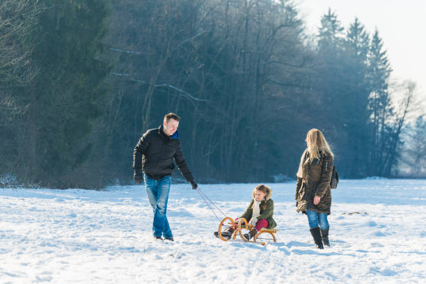 istock Family haveing fun on snow 1051878242