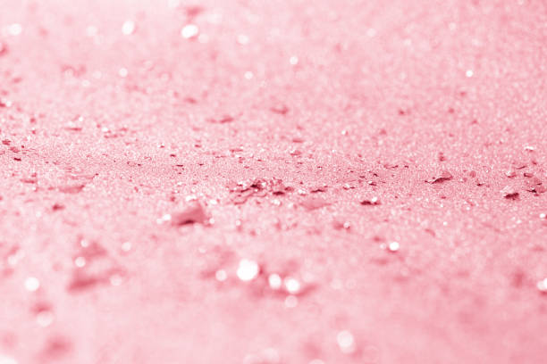istock Rose gold glitter confetti defocused background texture. 1051884760