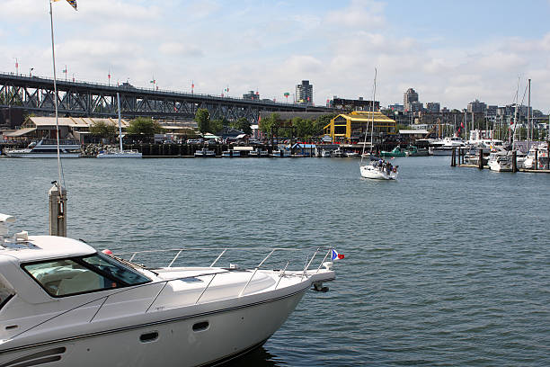 Looking across busy False Creek at the Granville Island Public Market in downtown Vancouver. British Columbia, Canada.