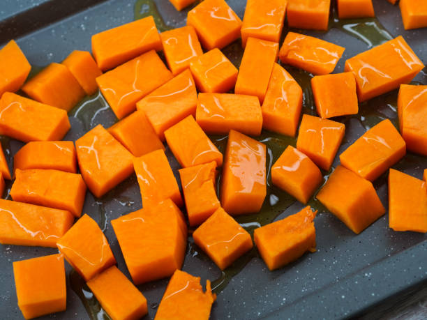 istock Chopped pumpkin drizzled with oil for baking 1051910112