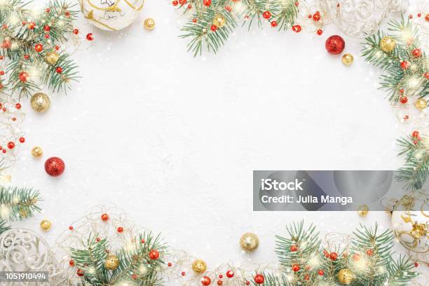 Christmas Frame Of Spruce Red Gold Christmas Decorations On White Space Stock Photo - Download Image Now