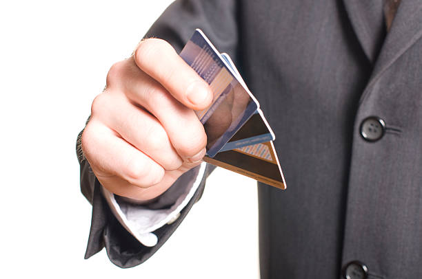 istock men's hand with credit card 105192067