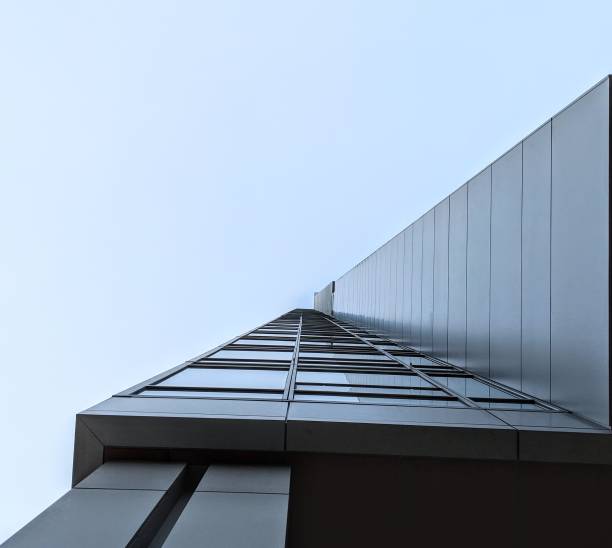 istock A office skyscraper up into the fog 1051925792