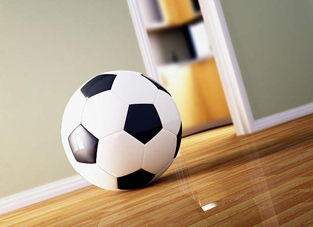 istock soccer ball on wood floor 105194802