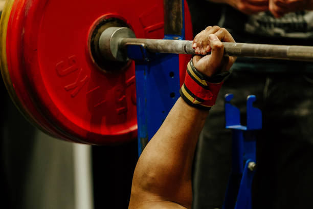 istock bench press hand athlete wrist wrap on barbell 1051960360