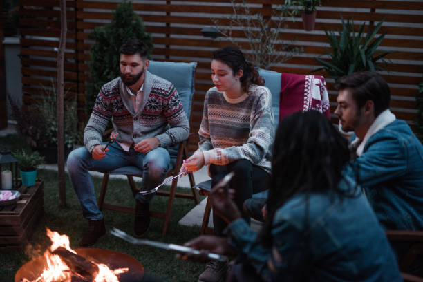 istock Group of Friends Gathered Around a Fire Pit 1051985626