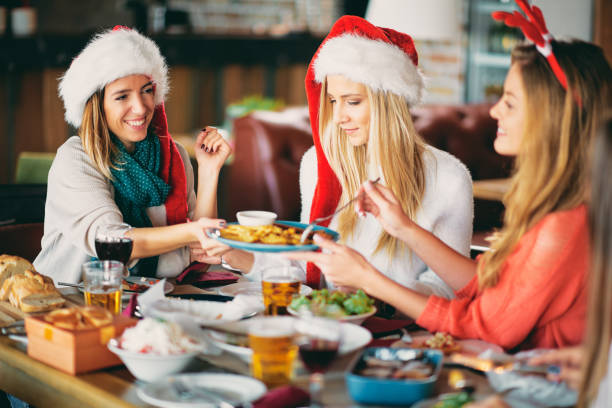 istock Friends having dinner at home at Christmas eve. 1051985926