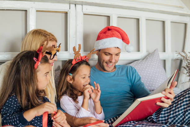 istock Young man reading for his family 1051987804